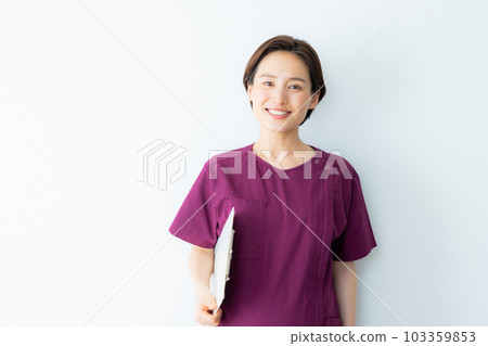 A woman in a wine red scrub A woman in a wine red scrub 103359853