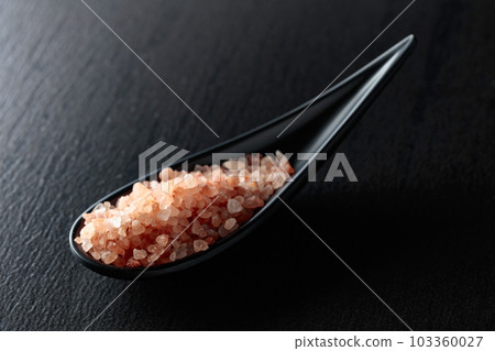 Pink salt on a black ceramic table. Pink salt on a black ceramic table. 103360027
