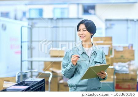 Female businessman in work clothes checking luggage Female businessman in work clothes checking luggage 103360190