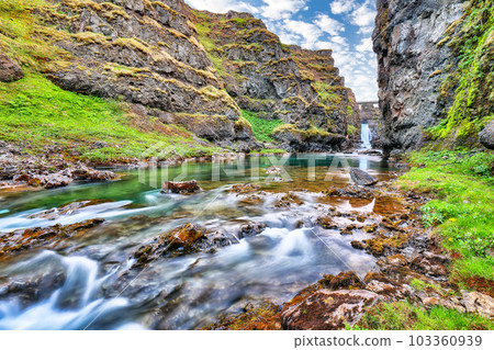 Breathtaking view of Kolugljufur canyon and Kolufossar falls. Breathtaking view of Kolugljufur canyon and Kolufossar falls. 103360939