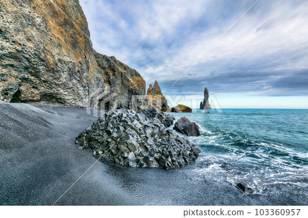 Breathtaking view of rock formations Troll Toes on Black beach Reynisfjara near the village of Vik. 103360957