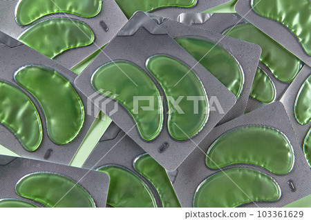 Eye patches set over green backgound. Face care beauty treatment concept 103361629