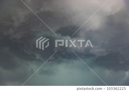 Clouds. Completely dark sky where storm clouds covered the city of Madrid. Storm clouds creating a very dramatic landscape. Rain and storm concept. Clouds. Completely dark sky where storm clouds covered the city of Madrid. Storm clouds creating a very dramatic landscape. Rain and storm concept. 103362225