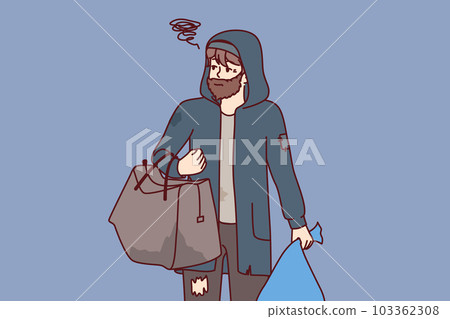 Man tramp with bag walks city streets in search of shelter or food thrown into trash Man tramp with bag walks city streets in search of shelter or food thrown into trash 103362308