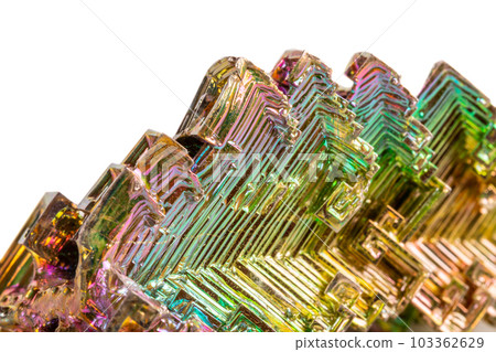 Macro of the mineral bismuth stone on a white background Macro of the mineral bismuth stone on a white background 103362629