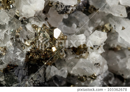 Macro mineral stone Galena, Sphalerite, Pyrite, Quartz on a black background Macro mineral stone Galena, Sphalerite, Pyrite, Quartz on a black background 103362678