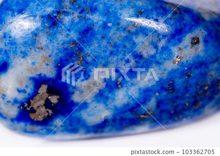 Macro mineral stone blue lapis lazuli (afghanistan) on white background 103362705