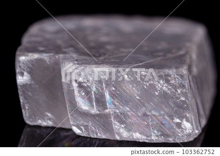 Macro mineral stone Iceland spar on black background 103362752