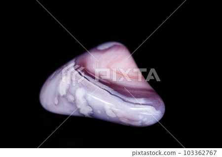 Macro mineral stone Agate pink Persian on a black background Macro mineral stone Agate pink Persian on a black background 103362767