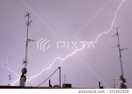 Lightning. Storm. Ray. Right moment where the sky lights up in a storm due to lightning. Lightning in the storm. Ray. Thunder. Flash of lightning. Storm concept. Lightning flash. Electric torment. Lightning. Storm. Ray. Right moment where the sky lights up in a storm due to lightning. Lightning in the storm. Ray. Thunder. Flash of lightning. Storm concept. Lightning flash. Electric torment. 103362808
