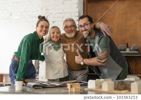 Young architects designing house for seniors client. Young architects designing house for seniors client. 103363253
