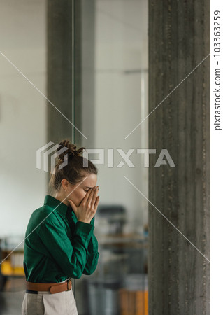 Young sad woman in office, having problem. 103363259