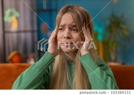 Displeased caucasian woman rubbing temples to cure headache problem, suffering from migraine, stress Displeased caucasian woman rubbing temples to cure headache problem, suffering from migraine, stress 103364131