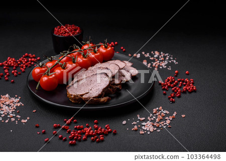 Delicious beef steak with salt, spices and herbs on a ceramic plate 103364498