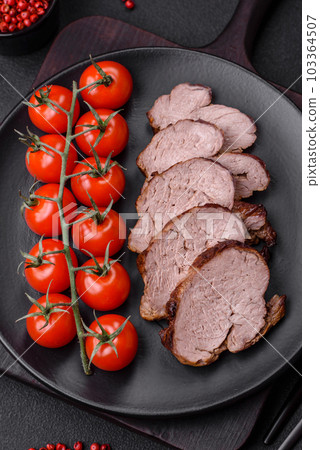 Delicious beef steak with salt, spices and herbs on a ceramic plate 103364507
