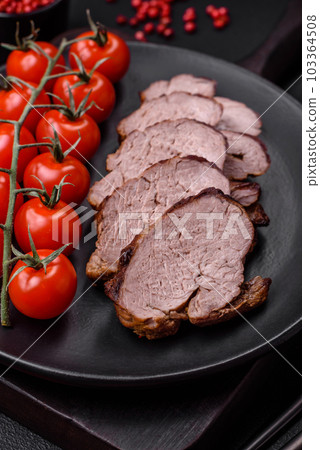 Delicious beef steak with salt, spices and herbs on a ceramic plate Delicious beef steak with salt, spices and herbs on a ceramic plate 103364508