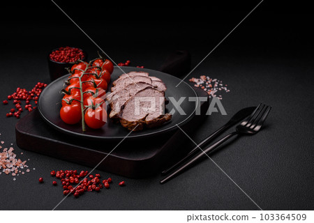 Delicious beef steak with salt, spices and herbs on a ceramic plate 103364509