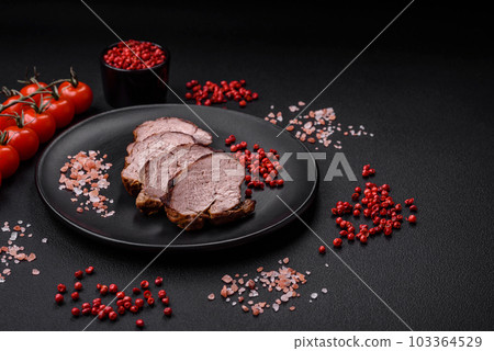 Delicious beef steak with salt, spices and herbs on a ceramic plate Delicious beef steak with salt, spices and herbs on a ceramic plate 103364529