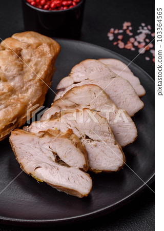 Delicious fresh grilled chicken fillet with salt, spices and herbs on a ceramic plate 103364565