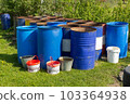 Metal water barrels for watering the garden. 103364938