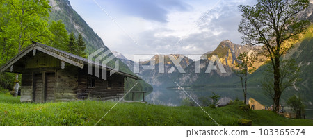 Wooden house on mountain lake Koenigssee Berchtesgaden National Park Bavaria Germany 103365674
