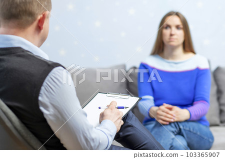 Professional help. The psychologist professional is talking to a client.  103365907