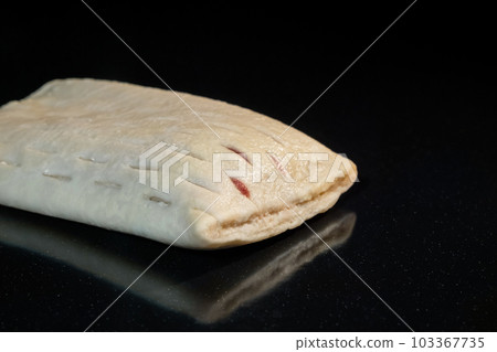 Uncooked bun with red strawberry jam on tray in electric oven: close up Uncooked bun with red strawberry jam on tray in electric oven: close up 103367735