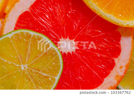 Citrus fruits slices - orange, grapefruit and lime - close up, top view 103367762