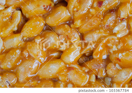 Caramelized nuts fried in honey - granola peanut bar - close up, top view 103367784