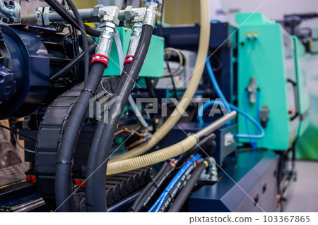 Part of automatic injection molding machine and plastic hoses at exhibition 103367865