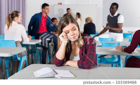 Unhappy girl student in class Unhappy girl student in class 103369466