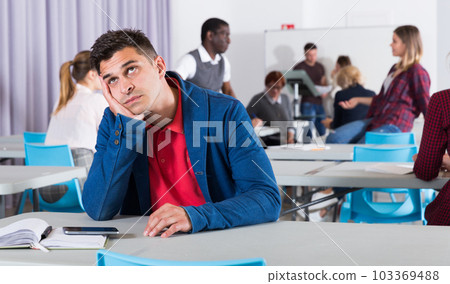 Frustrated man student Frustrated man student 103369488