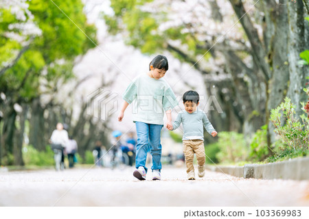 sister holding brother's hand sister holding brother's hand 103369983
