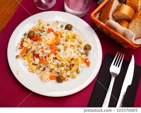 Mix salad with boiled rice, corn and omlette at plate Mix salad with boiled rice, corn and omlette at plate 103370005