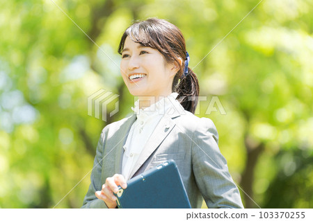 Photo of a woman standing in the greenery 103370255