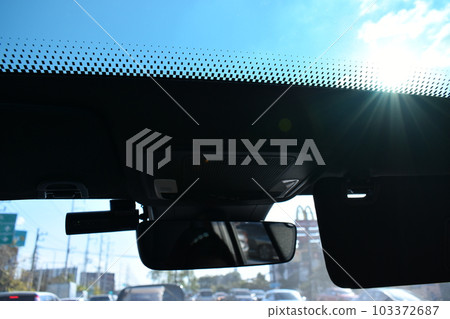 sunroof of car with blue sky, interior design 103372687