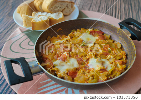 Turkish Menemen omelet in a frying pan. . Turkish Menemen omelet in a frying pan. . 103373350