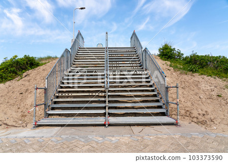 iron emergency stairs on the coast 103373590