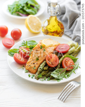 Baked Delicious salmon, green asparagus on plate Baked Delicious salmon, green asparagus on plate 103373745