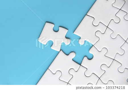 Separated jigsaw puzzle with customizable space for text. Copy space with blue background. 103374218