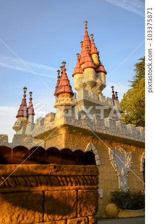 Fragment of the towers of a fairy-tale castle in a town built for children Fragment of the towers of a fairy-tale castle in a town built for children 103375871
