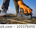 Garbage collection on the beach. Ecology concept. Close-up view.  103376456