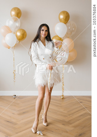 Romantic happy european girl holding 30th birthday balloon 103376884