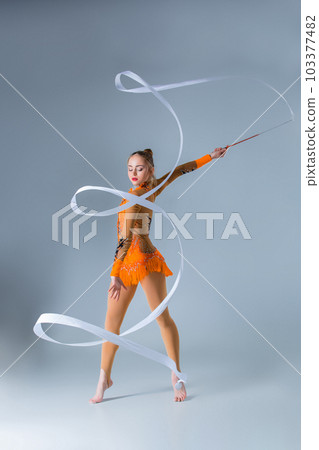 beautiful Caucasian girl gymnast with white ribbon 103377482