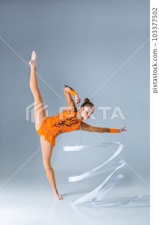 beautiful Caucasian girl gymnast with white ribbon beautiful Caucasian girl gymnast with white ribbon 103377502
