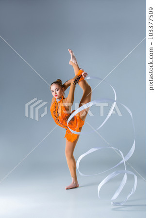 beautiful Caucasian girl gymnast with white ribbon 103377509