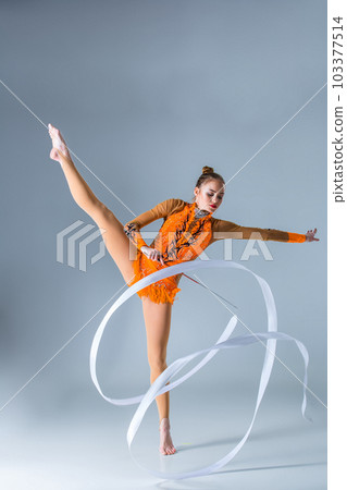 beautiful Caucasian girl gymnast with white ribbon 103377514
