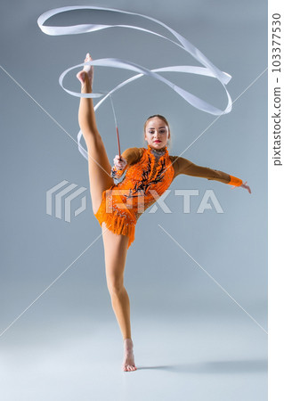Young gymnast on a white background. 103377530