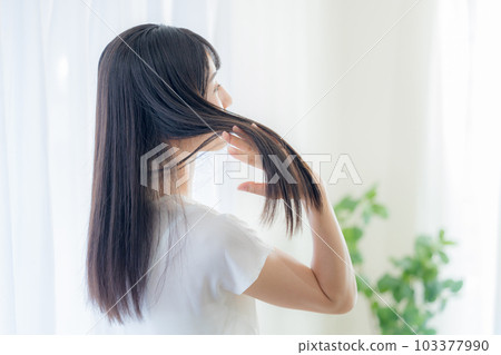 Hair care image: Back view of a woman with long hair Hair care image: Back view of a woman with long hair 103377990