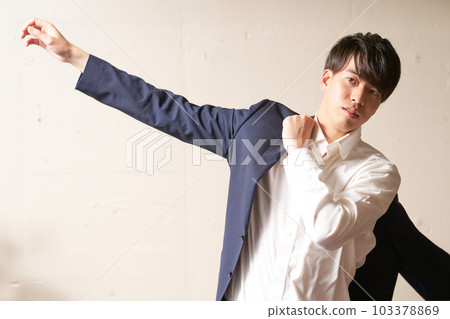 Young man wearing a jacket business casual image 103378869